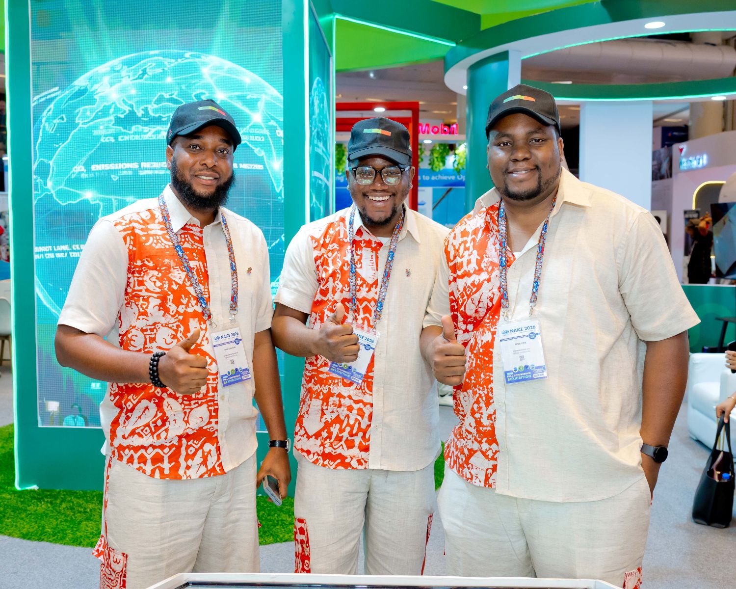SIGNALers giving a thumbs up at NAICE 2026.