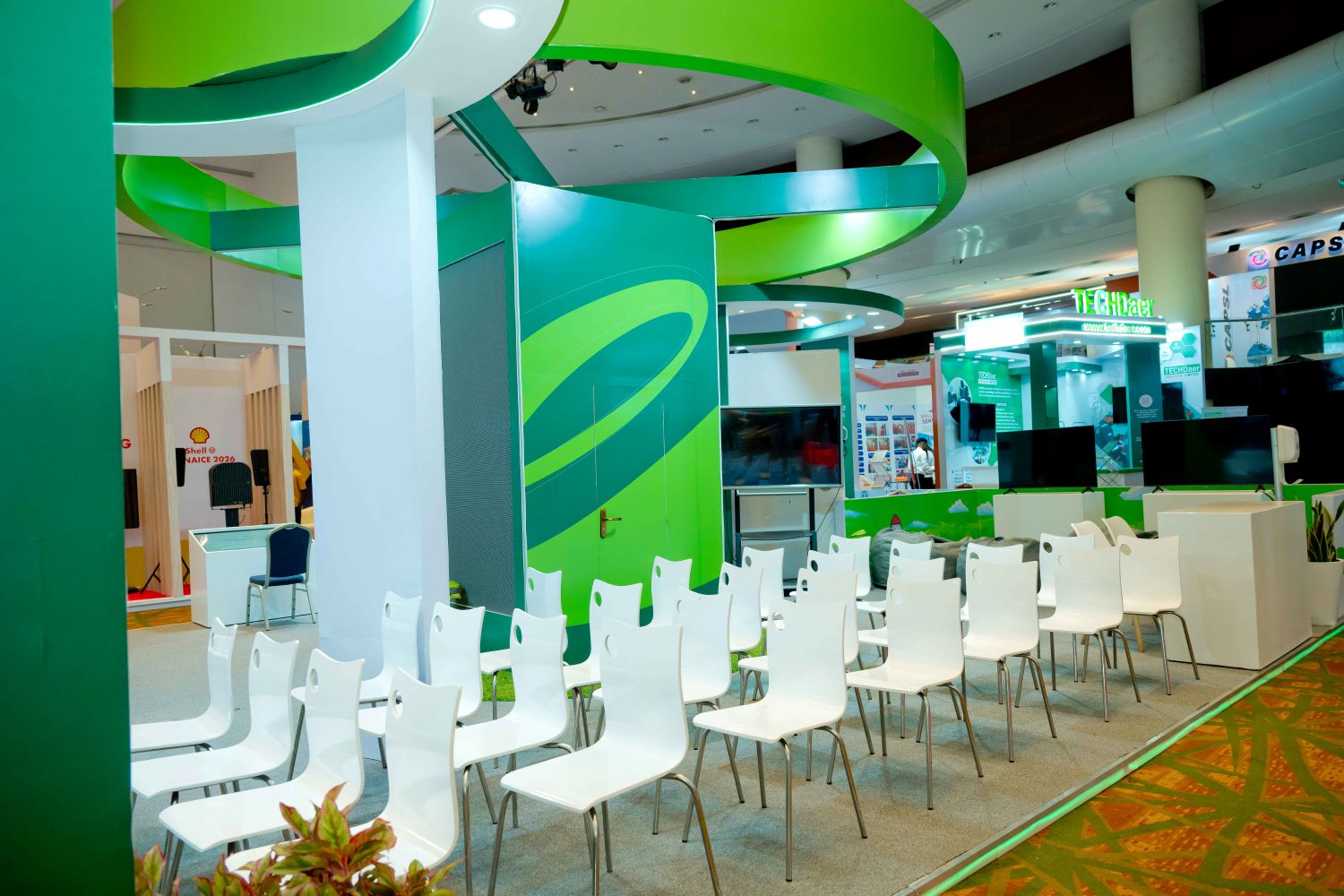 The Seplat stand at NAICE 2026, set up with rows of white chairs for a session.